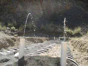 A pressurized drainfield being tested during a construction inspection.